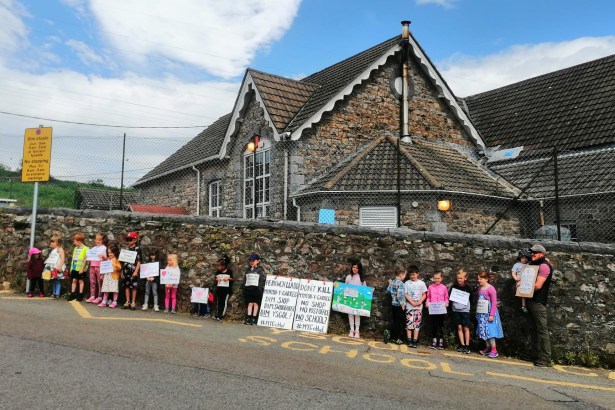 Parents and pupils protest outside Mynyddygarreg School in Carmarthenshire, a campaign Carl Peters‑Bond supported. The school was saved from closure after the community successfully lobbied the council.